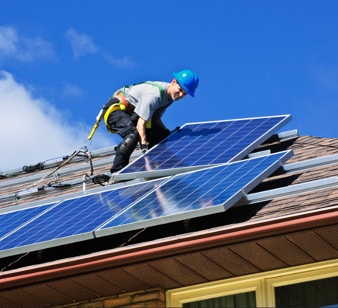 Installing solar panels in a house in Lancashire